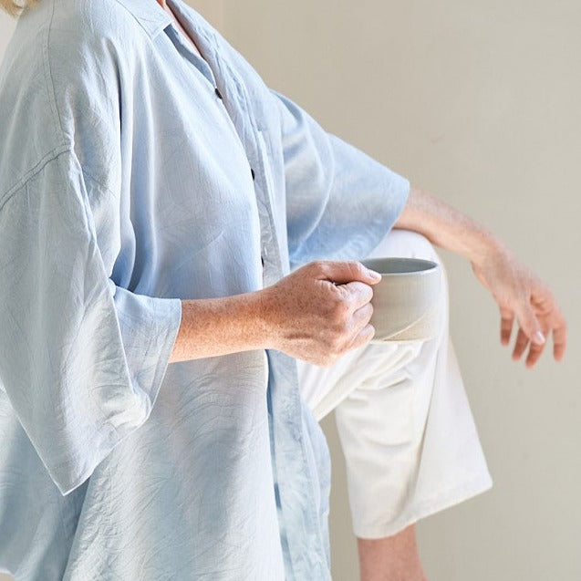 ritual ceramic mugs held by artist